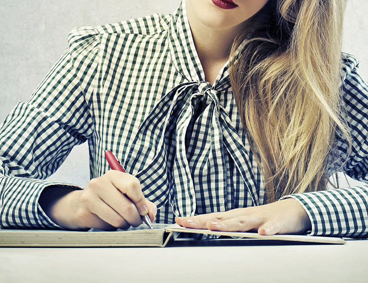 Fashionable lady writing